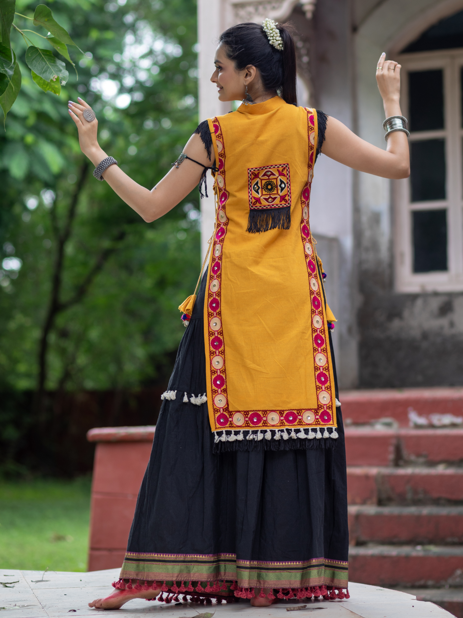 Mustard yellow traditional embroidered panel top with black  daman flairy skirt
